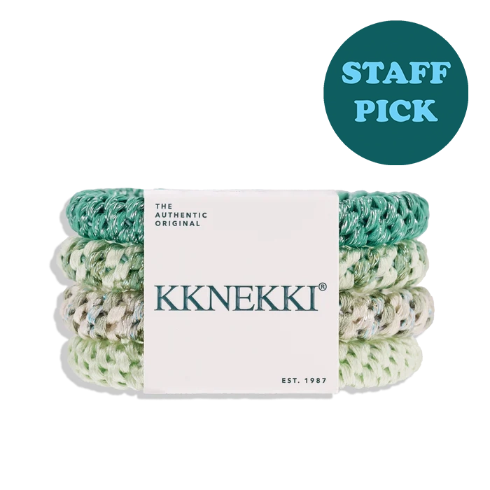 Three rolled KKNEKKI staff picks wrapped in a white paper band, stacked vertically. The staffs have a marbled pattern of teal, mint green, and white.