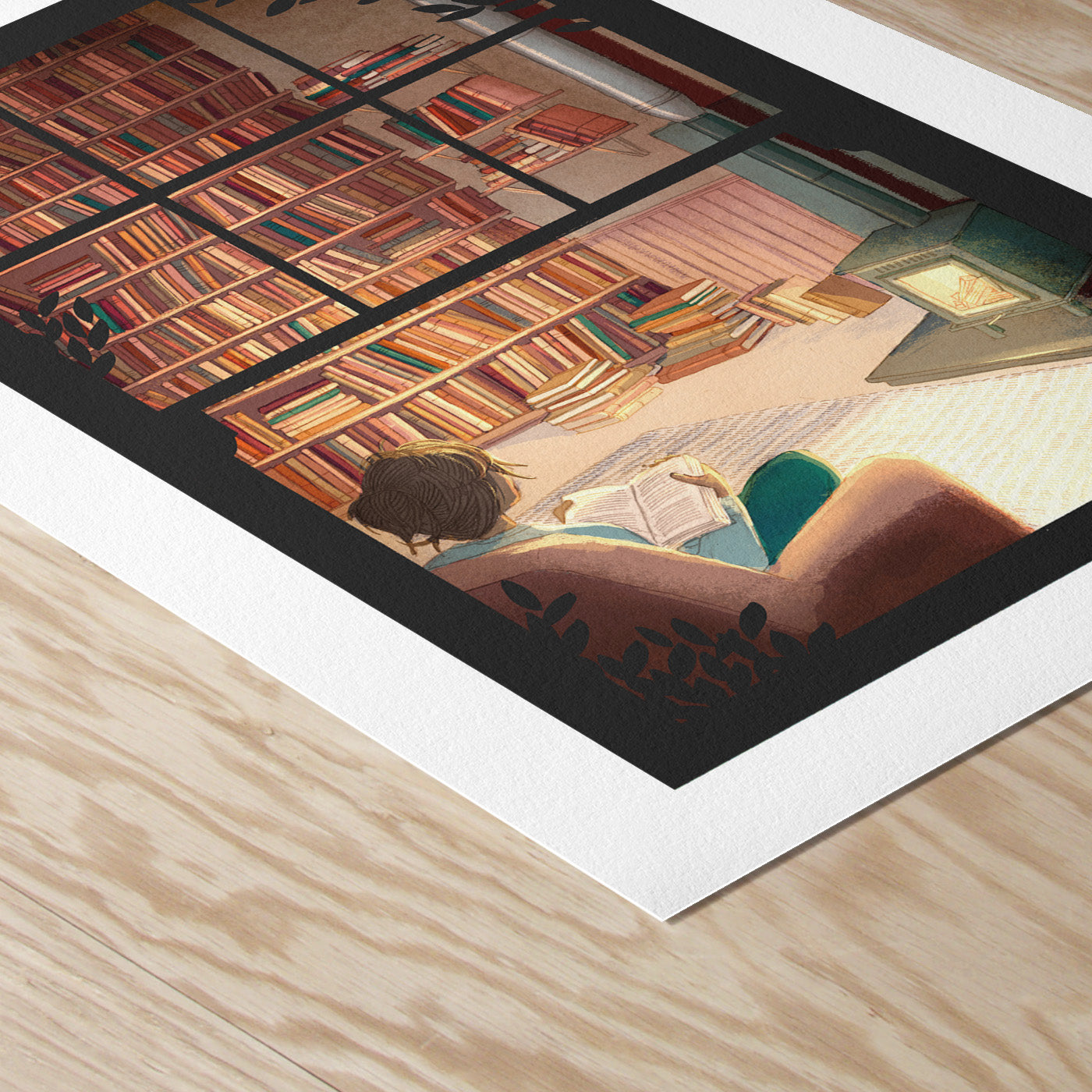 Framed artwork of a person reading a book in a cozy room with bookshelves.