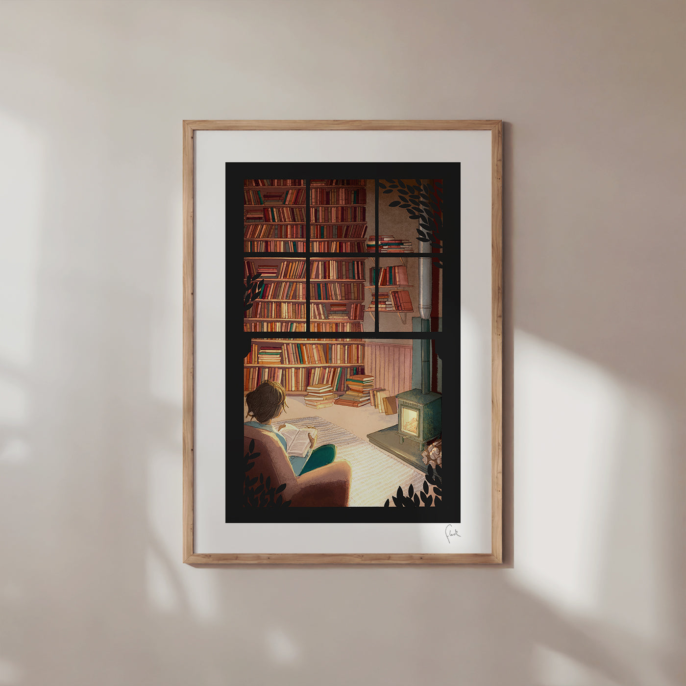 Framed artwork of a person reading in a room with bookshelves and a fireplace.