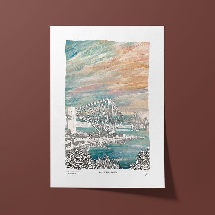 Art print of a bridge with a colorful sky on a white border against a brown background